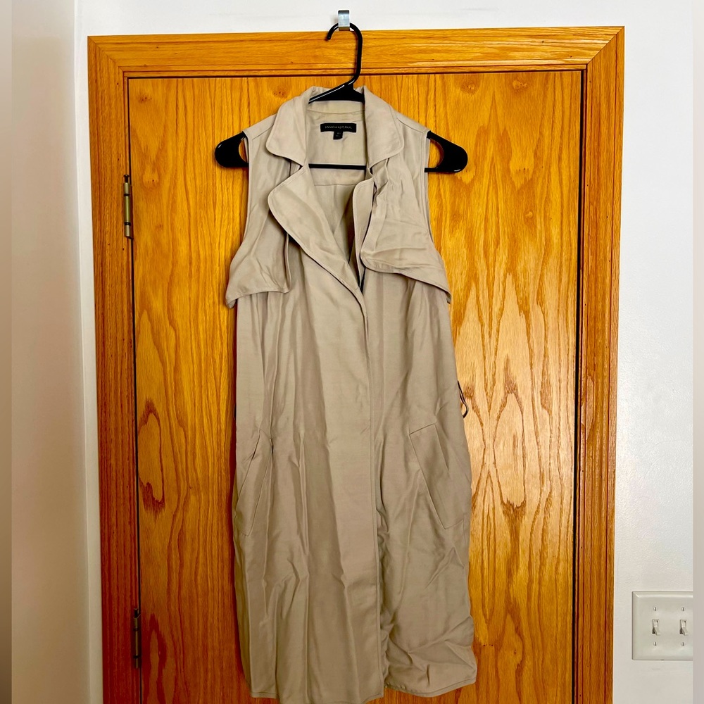 Tan long vest. Super cute with leggings or jeans and a long sleeve or tshirt.